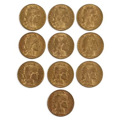 six gold sovereigns of various sizes and shapes on a white surface