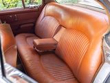 a brown leather seat in the back of a car