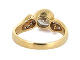 an image of a gold ring with a white diamond