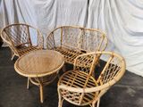 four chairs and a table that are sitting on the floor