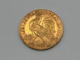 an image of a gold coin with a rooster on it