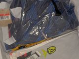 a suitcase that is wrapped in plastic on the floor