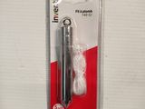 a pair of scissors in a package on a table
