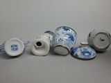 several blue and white porcelain vases are sitting on a table