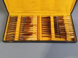 many knives in a case that are on the table