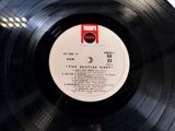 an image of a record with a label on it sitting on top of a table