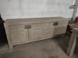 a picture of a wooden entertainment center in a garage