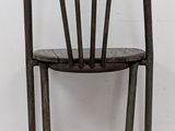 a chair that is sitting in front of a white wall