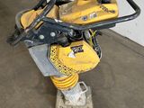 a close up of a yellow and black machine in a room