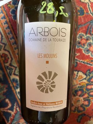 a bottle of wine that is sitting on a table