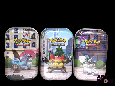 three tins of pokemon cards on a black background