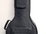 a guitar case sitting on the floor next to a wall