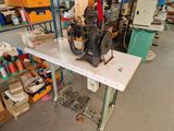 a sewing machine that is sitting on a table