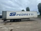a semi truck that is parked in a parking lot