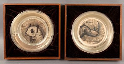 two plates with a picture of a man and a woman on them