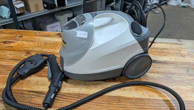 a vacuum that is sitting on a wooden table