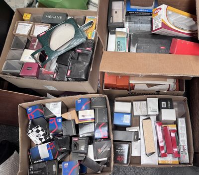 many boxes of electronic devices in a pile on the floor