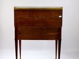 a small wooden table with a drawer on it