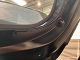 a close up of a car door with a window open
