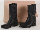 black leather cowboy boots with zippers on the side and a box