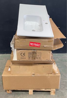 a pile of boxes with a sink on top of it