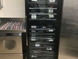 two refrigerators that are next to each other in the kitchen