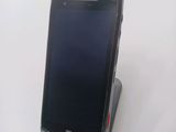 a cell phone that is sitting on top of a stand
