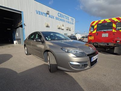 a silver car that is parked in front of a firetruck