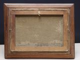 an old picture frame with a piece of wood in it