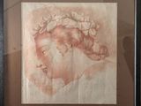 un dessin représentant la tête d'une femme de profil, avec une fleur dans les cheveux