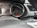 a close up of a car dashboard with a speedometer