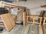 several pieces of wood are stacked on top of each other in a garage