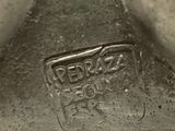 a close up of a metal object with a sign on it