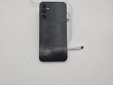 the back of a black phone with a white cord attached to it