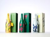 several bottles of wine are lined up on a table