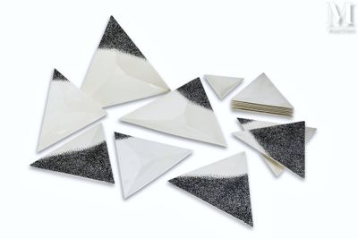 several pieces of black and white paper are scattered on top of each other