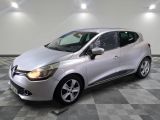 a silver car is parked in a room with a checkered floor