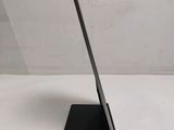 the ipad is sitting on top of a stand on a white surface