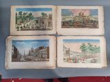 three old books with pictures of buildings and people on them sitting on a table