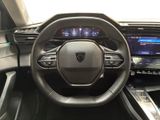 the interior of a car with a steering wheel and dashboard controls
