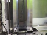 stainless steel counter top with ovens and other appliances in a commercial kitchen