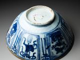 a blue and white bowl sitting on a table