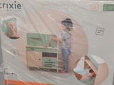 a box with a picture of a child playing with a toy kitchen