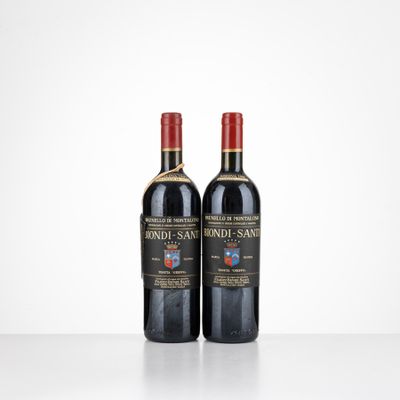 two bottles of wine sitting on top of a table