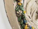 an image of a decorative wall plaque of a woman