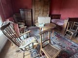 a living room with a couch, chair, table and a rug