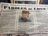journal sur lequel figure la photo d'un homme en uniforme militaire