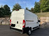 a white van that is parked in a parking lot