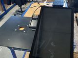 a laptop computer sitting on top of a workbench