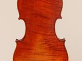 an old violin with a wooden back and a long neck